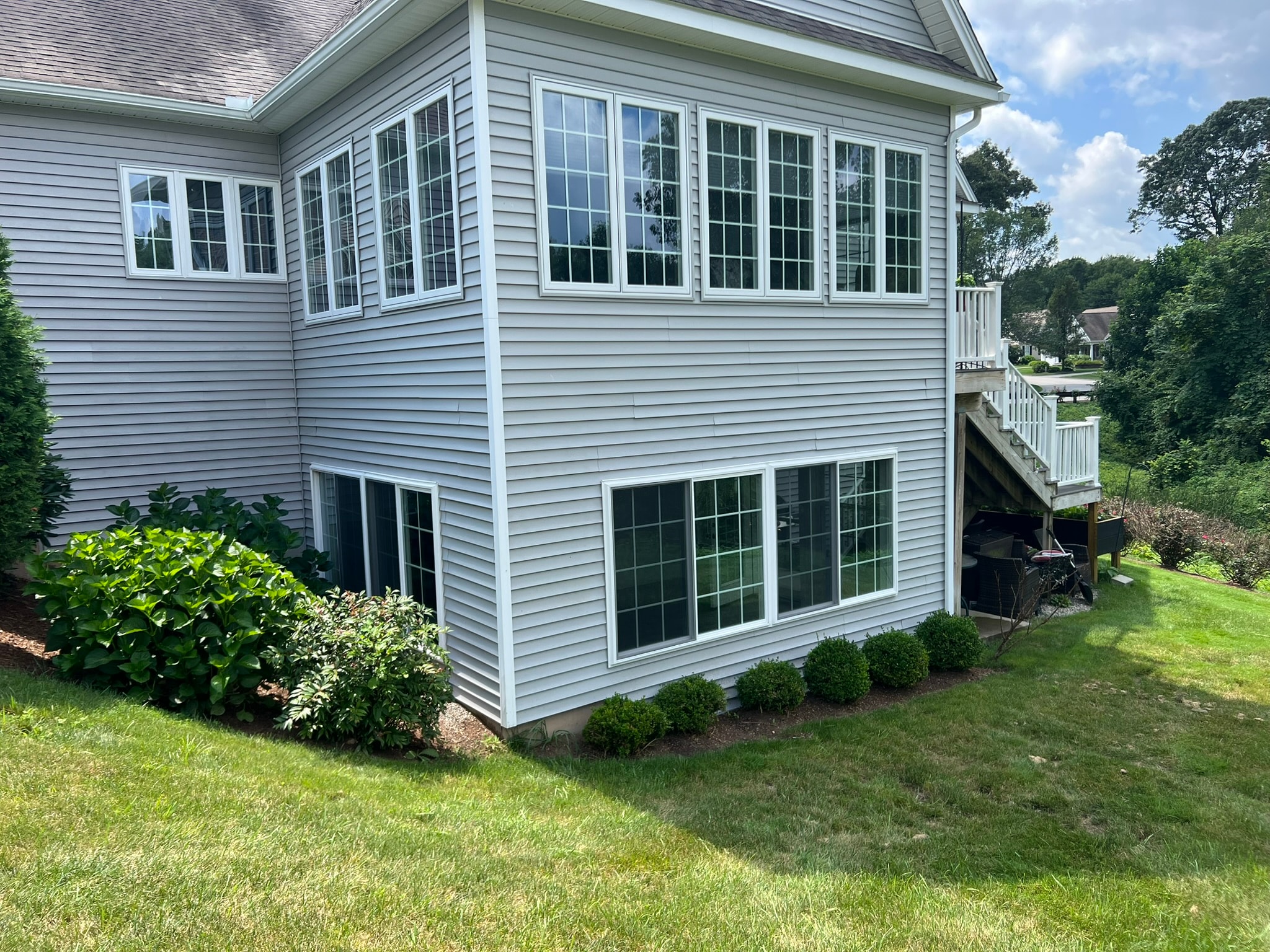 Outdoor living space and three-season porch by Sunrise Construction
