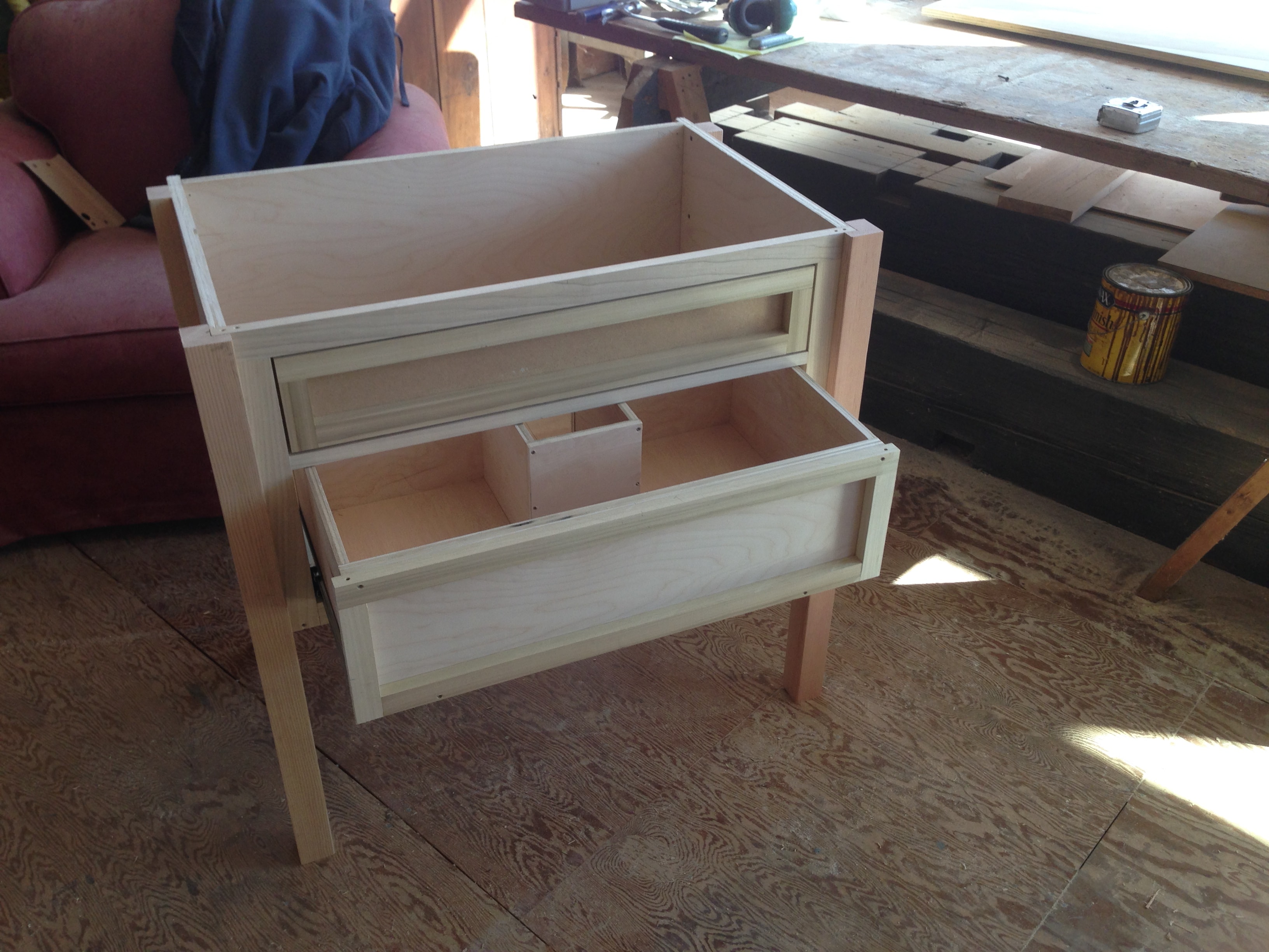 Custom bathroom vanity being built in the shop — drawer boxes and face frame assembly