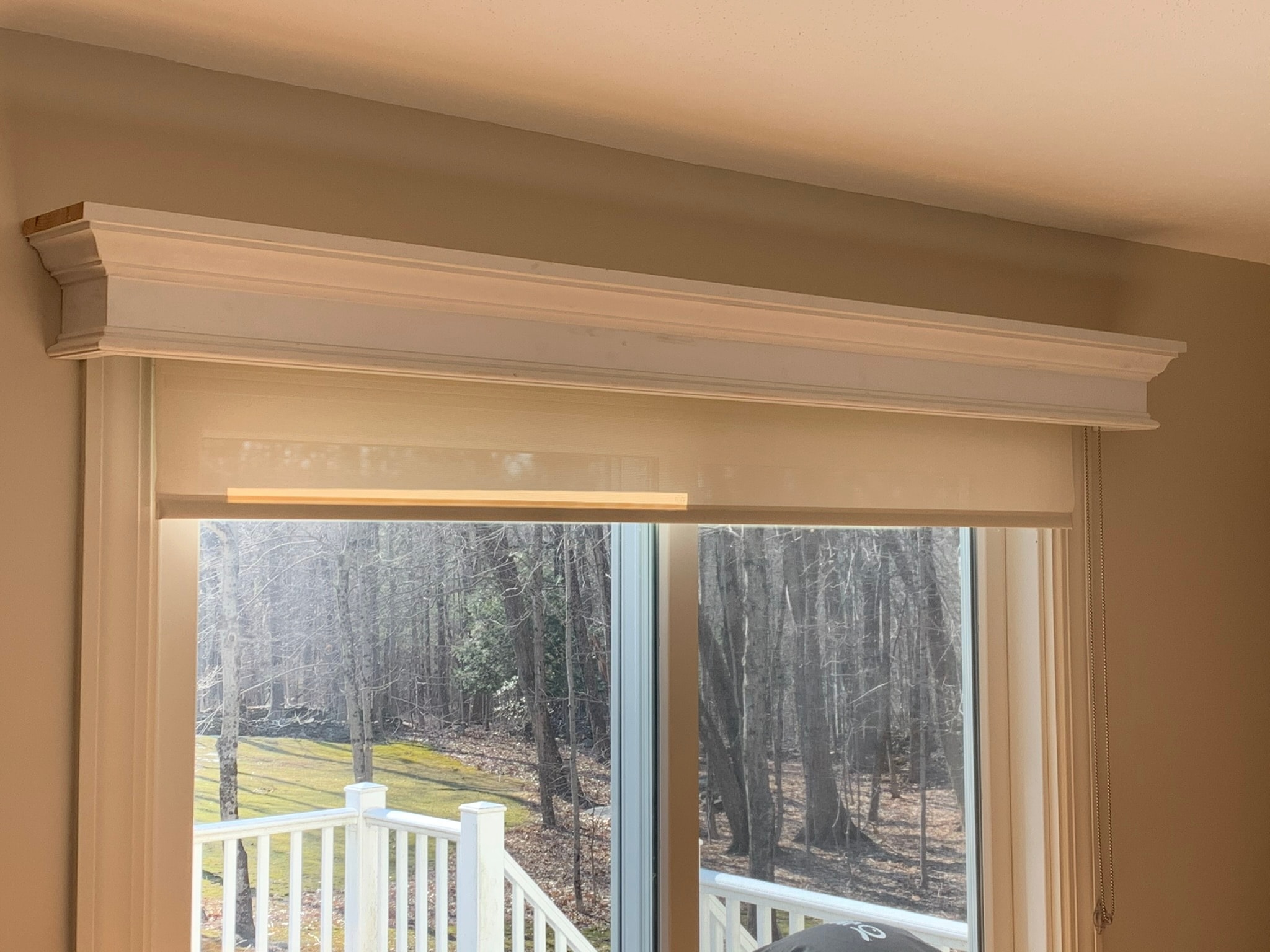Custom pass-through access door built into wall between closet and bedroom — white shaker panel detail