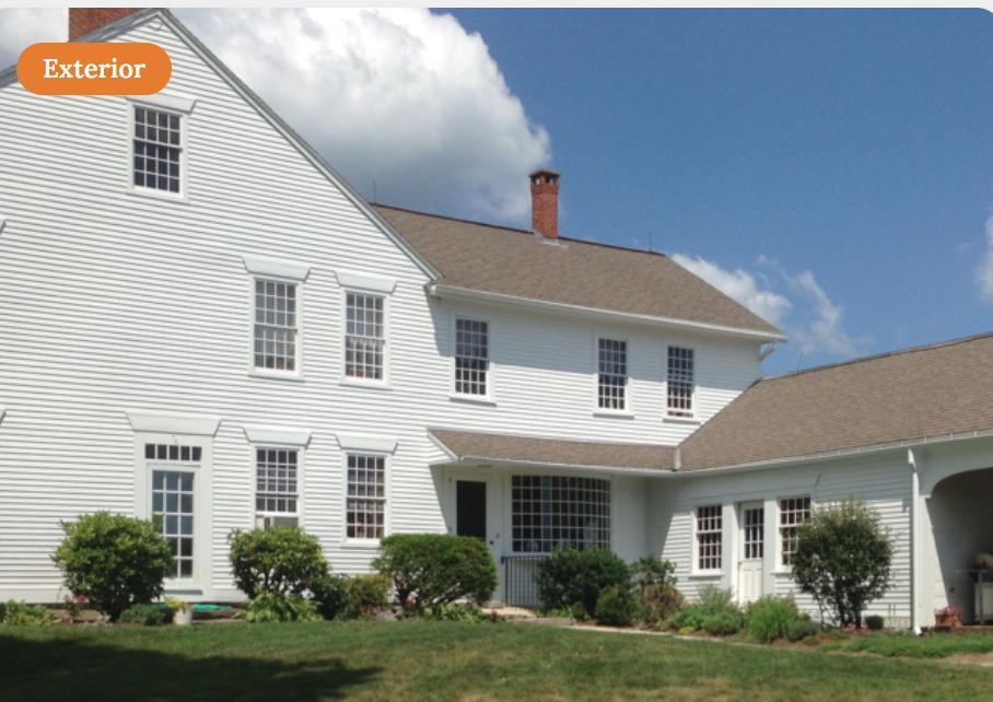 Grand farmhouse exterior restoration completed by Sunrise Construction in Connecticut